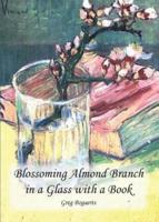 Blossoming Almond Branch in a Glass With a Book