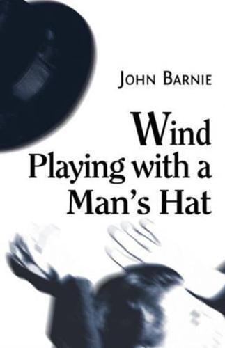 Wind Playing With a Man's Hat