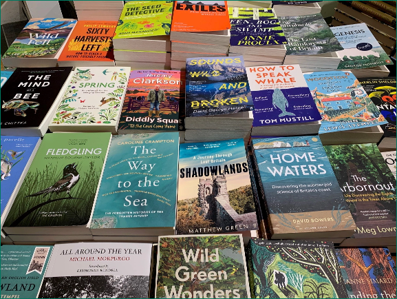 A table top spread of various books form the collection